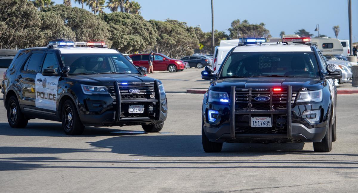 Using a roadblock to stop a fleeing suspect is a Fourth Amendment seizure of the person